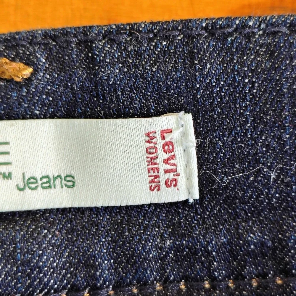 Levis 542 Flare Jeans Women 22M Dark Wash Blue Denim Distressed Hem Mid Rise y2k